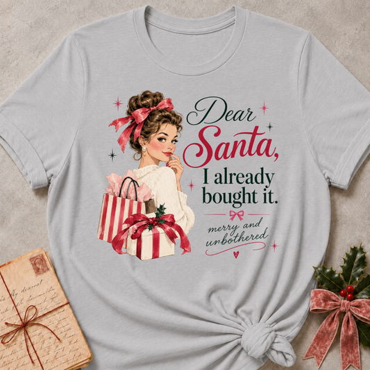 Athletic Heather relaxed fit tee with Dear Santa, I already bought it lettering, a vintage holiday shopper with striped gift boxes and red bows