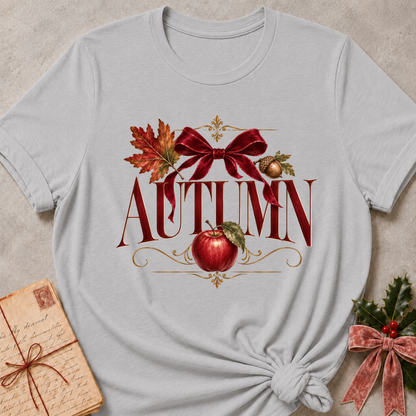 Athletic heather grey women's relaxed tee with a vintage AUTUMN serif design with a burgundy velvet bow, maple leaf, acorn, and red apple