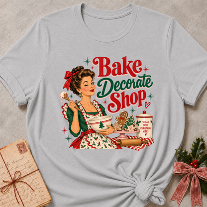 Athletic heather grey relaxed fit tee with a winking retro baker and Bake Decorate Shop lettering