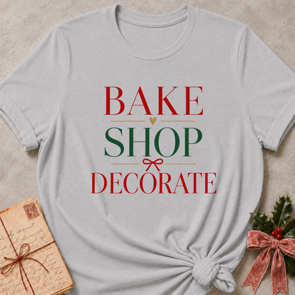 Athletic Heather relaxed fit tee with Bake Shop Decorate in red and green lettering, a gold heart and a small red bow