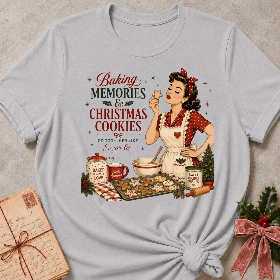 Athletic heather grey relaxed fit tee with a retro baker and a tray of Christmas cookies