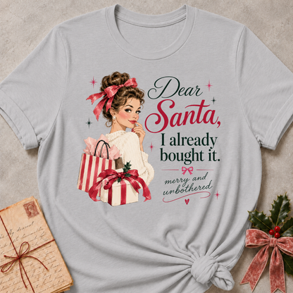 Athletic Heather relaxed fit tee with Dear Santa, I already bought it lettering, a vintage holiday shopper with striped gift boxes and red bows