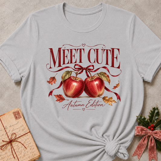 Athletic Heather relaxed fit tee with Meet Cute Autumn Edition lettering, two red apples and a burgundy bow
