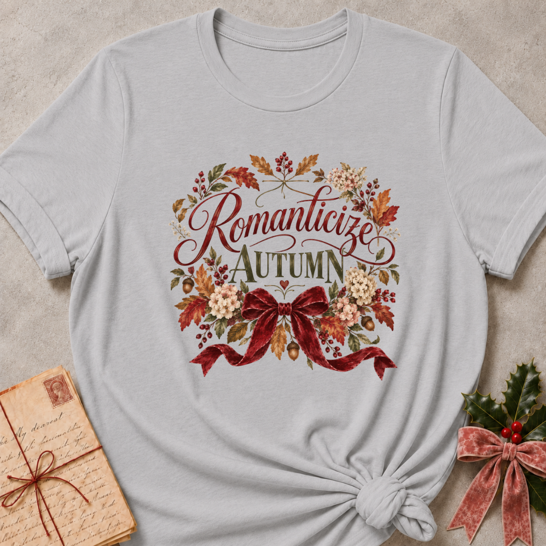 Athletic Heather relaxed fit tee with Romanticize Autumn script lettering, autumn leaves, cream blooms and a burgundy velvet bow