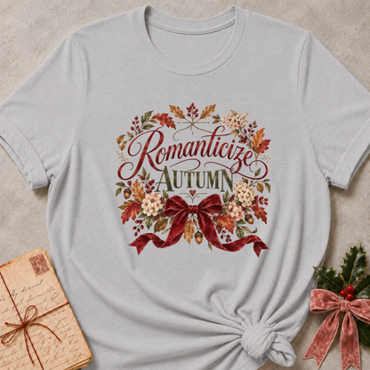 Athletic Heather relaxed fit tee with Romanticize Autumn script lettering, autumn leaves, cream blooms and a burgundy velvet bow