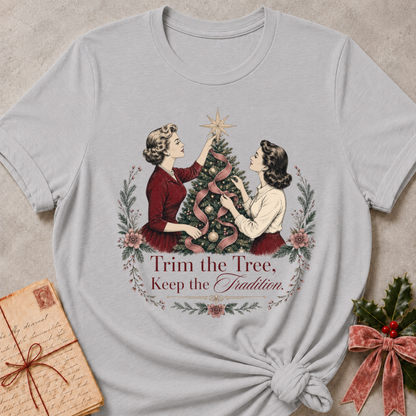 Athletic heather grey relaxed fit tee with two vintage women trimming a Christmas tree and Trim the Tree Keep the Tradition lettering