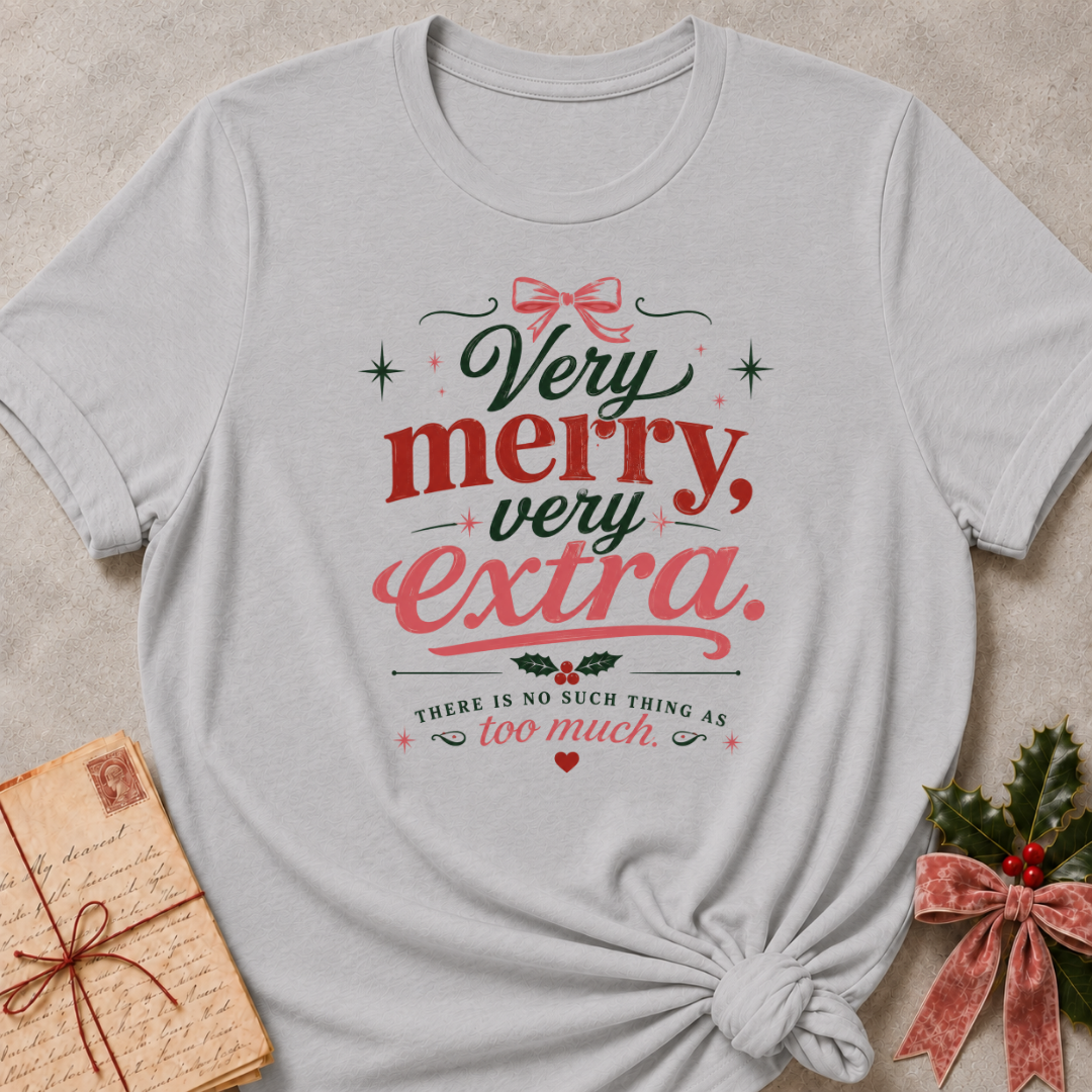 Athletic Heather relaxed fit tee with Very Merry, Very Extra retro lettering, a pink bow, holly and scattered stars