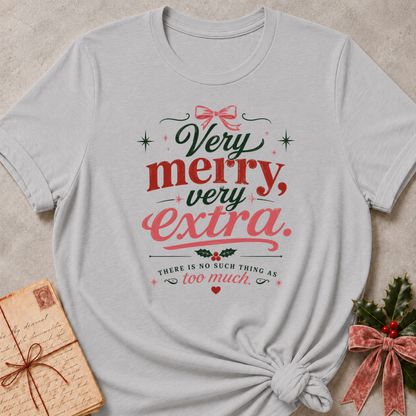 Athletic Heather relaxed fit tee with Very Merry, Very Extra retro lettering, a pink bow, holly and scattered stars