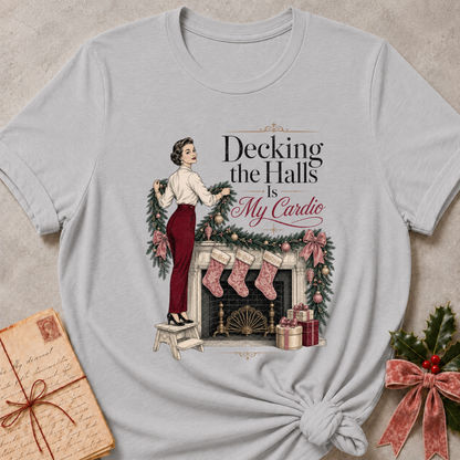 Athletic Heather relaxed fit tee with Decking the Halls Is My Cardio lettering, a vintage woman hanging garland above a mantel of stockings, bows and gifts