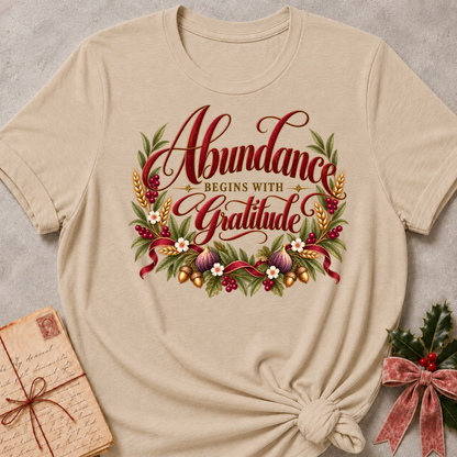 Heather Stone relaxed fit tee with Abundance Begins with Gratitude script, golden wheat, figs, acorns and a ruby ribbon
