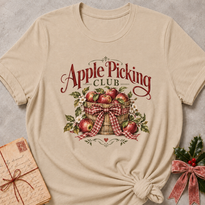 Heather Stone relaxed fit tee with an Apple Picking Club basket of red apples, blossoms and a gingham bow