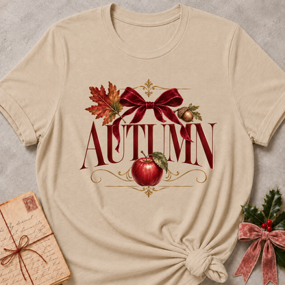 Heather stone women's relaxed tee with a vintage AUTUMN serif design with a burgundy velvet bow, maple leaf, acorn, and red apple