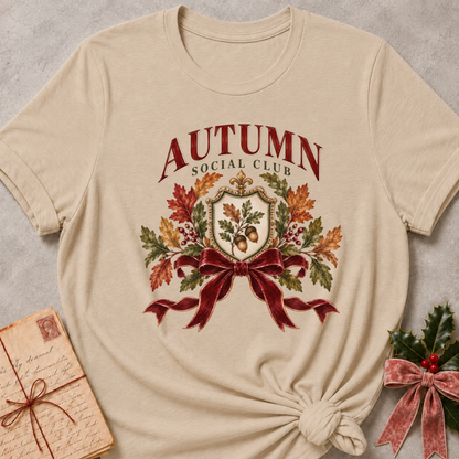 Heather Stone relaxed fit tee with an Autumn Social Club crest, oak leaves, acorns and a burgundy bow