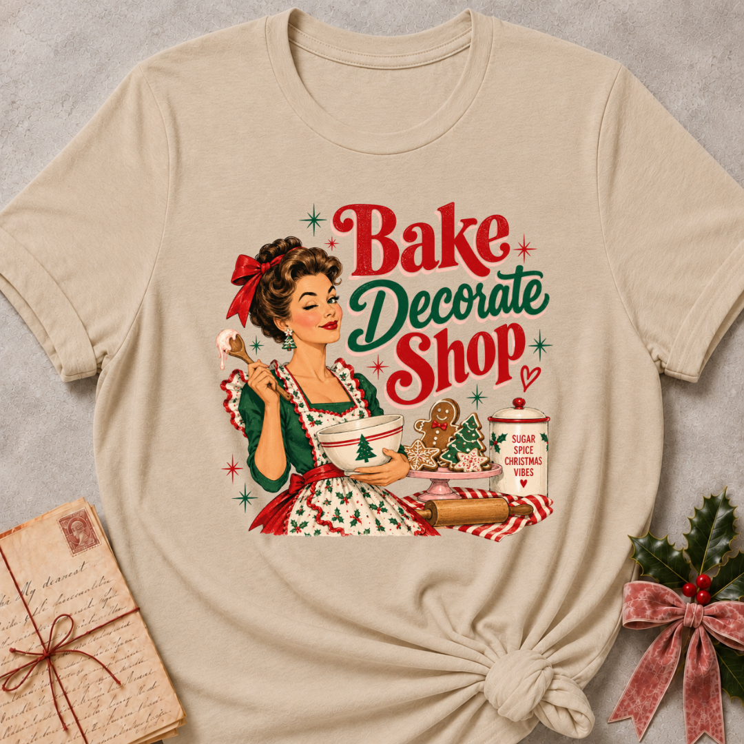 Heather stone relaxed fit tee with a winking retro baker and Bake Decorate Shop lettering