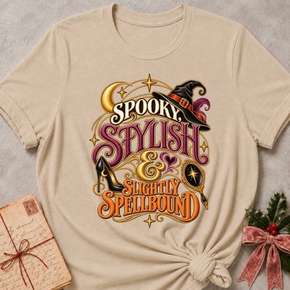 Heather Stone Spooky, Stylish and Slightly Spellbound tee with a witch's hat, stiletto heel and gilded hand mirror