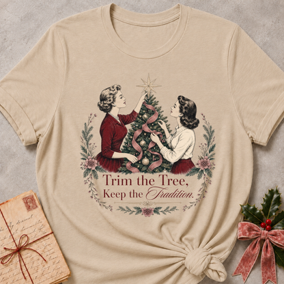 Heather stone relaxed fit tee with two vintage women trimming a Christmas tree and Trim the Tree Keep the Tradition lettering