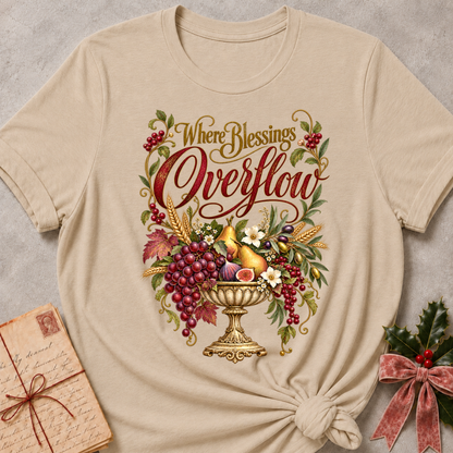 Heather Stone relaxed fit tee with Where Blessings Overflow script and a golden urn of grapes, pears, figs and wheat