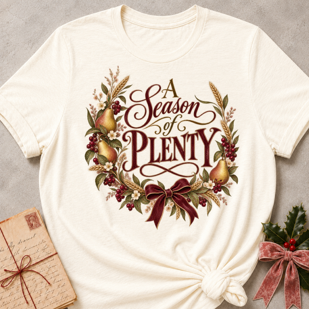 Natural relaxed fit tee with A Season of Plenty script, golden pears, wheat, berries and a burgundy bow