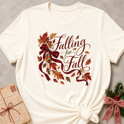 Natural relaxed fit tee with Falling for Fall script, a burgundy velvet bow and swirling autumn leaves