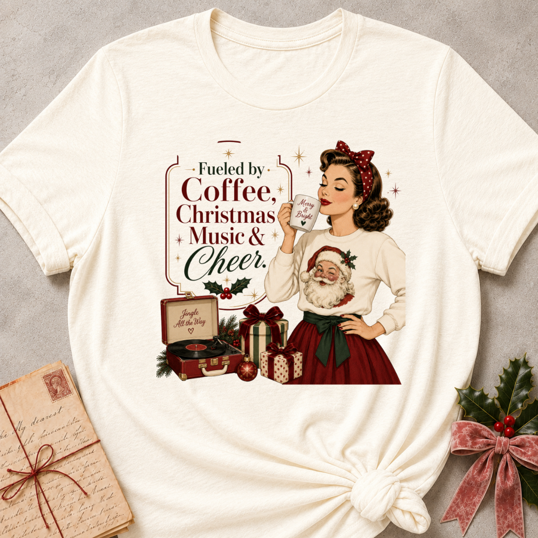 Natural cream relaxed fit tee with a retro Christmas pinup and Fueled By Coffee Christmas Music and Cheer lettering