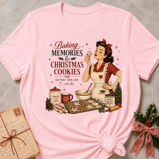 Soft pink relaxed fit tee with a retro baker and a tray of Christmas cookies