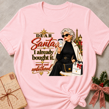 Pink relaxed fit tee with Dear Santa, I already bought it lettering, a merry and unbothered shopper in sunglasses with an iced coffee and gift bags