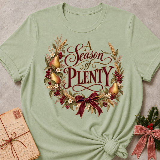 Sage relaxed fit tee with A Season of Plenty script, golden pears, wheat, berries and a burgundy bow