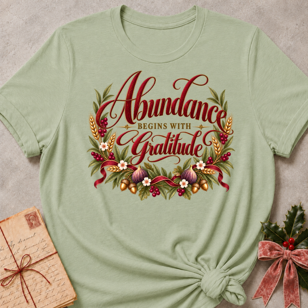 Sage relaxed fit tee with Abundance Begins with Gratitude script, golden wheat, figs, acorns and a ruby ribbon