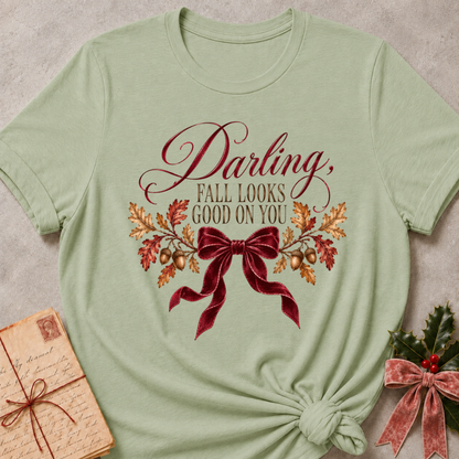 Sage women's relaxed tee with a Darling, Fall Looks Good On You script design with a burgundy velvet bow, oak leaves, and acorns