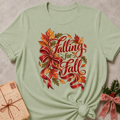 Sage relaxed fit tee with Falling for Fall script, an oversized burgundy bow and swirling autumn leaves