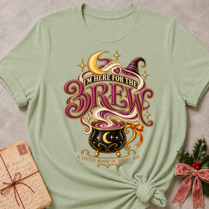 Sage I'm Here For The Brew tee with a moonlit cauldron mug, crescent moon and witch's hat in plum and gold