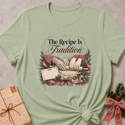 Sage green relaxed fit tee with hands rolling dough and The Recipe Is Tradition lettering