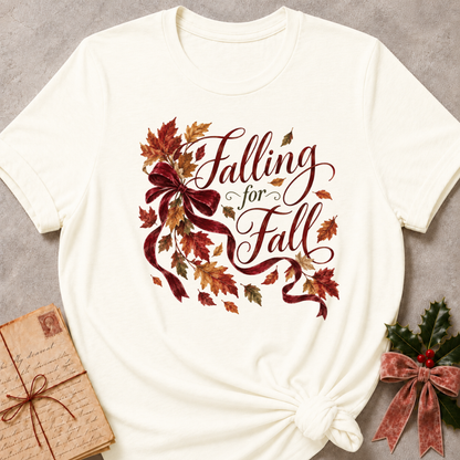 Vintage White relaxed fit tee with Falling for Fall script, a burgundy velvet bow and swirling autumn leaves