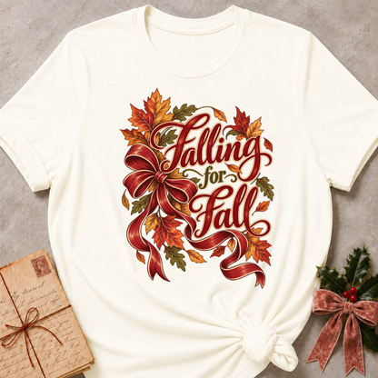Vintage White relaxed fit tee with Falling for Fall script, an oversized burgundy bow and swirling autumn leaves