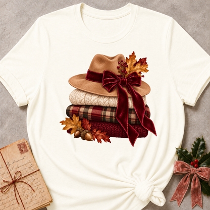 Vintage White relaxed fit tee with stacked knit sweaters, cozy hats and a plaid bow