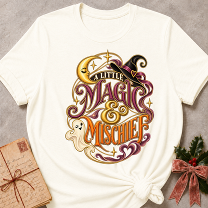 Vintage White A Little Magic & Mischief tee with a smiling ghost, sleepy crescent moon and witch's hat in gold and plum