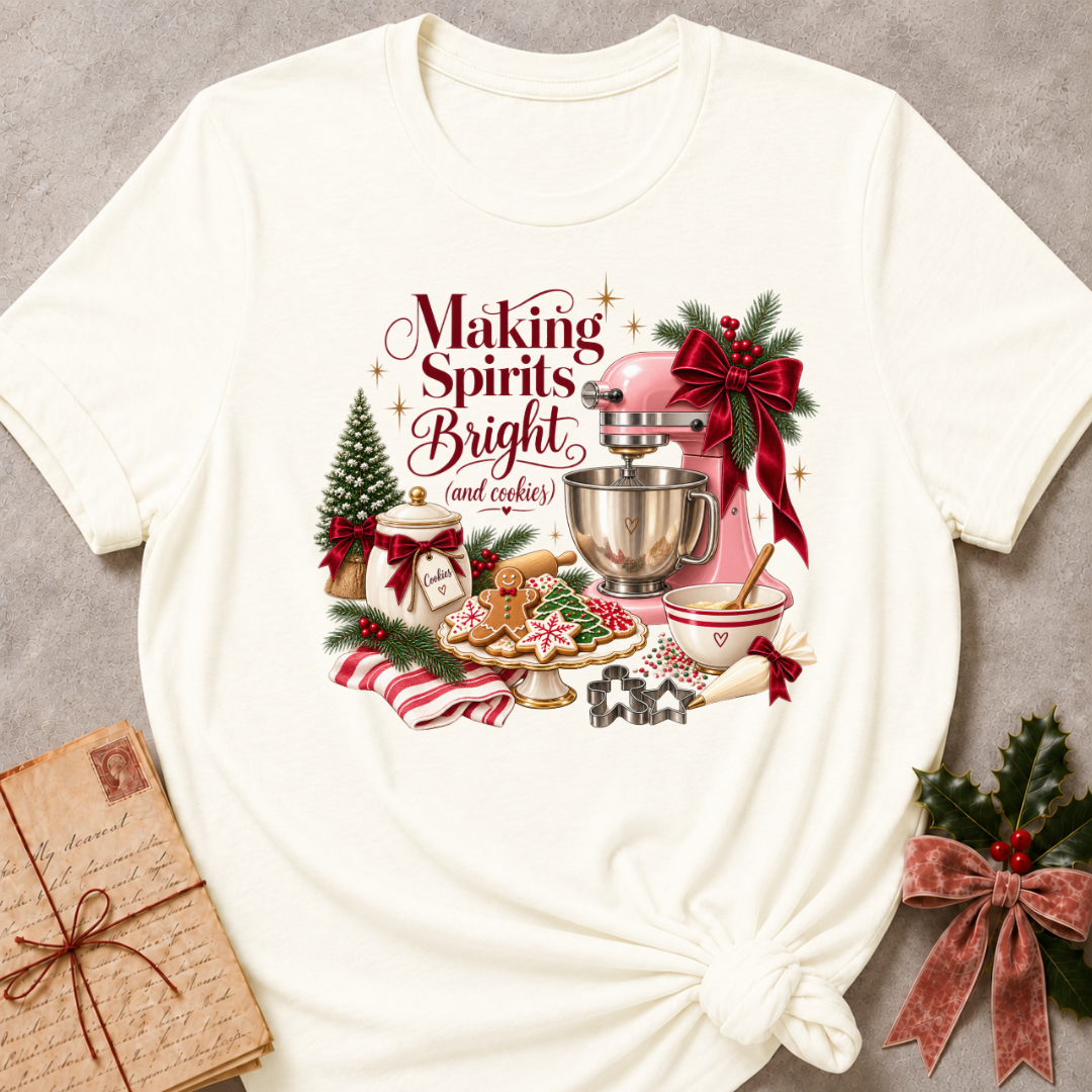 Vintage white relaxed fit tee with a vintage Christmas baking scene and Making Spirits Bright lettering