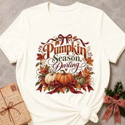 Vintage white women's relaxed tee with a Pumpkin Season, Darling script design with heirloom pumpkins, autumn leaves, and burgundy ribbon bows