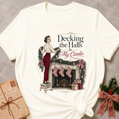 Vintage White relaxed fit tee with Decking the Halls Is My Cardio lettering, a vintage woman hanging garland above a mantel of stockings, bows and gifts